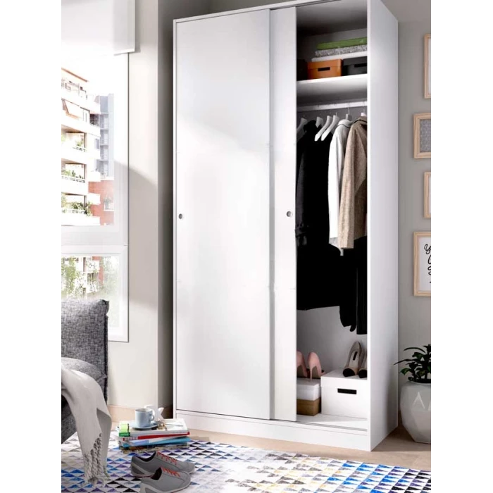 Wardrobe closet measuring 100 x 50 with shelf and hanging rod. Sliding doors to save space.