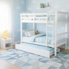 Minerva Vicawu wooden bunk bed with pull-out trundle drawer in decorated bedroom with pastel bedding
